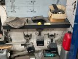 a picture of a room with a bunch of tools on the counter