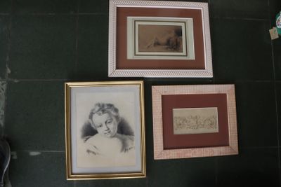 three framed pictures on the wall of a bathroom