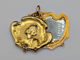 a gold locke with a picture of a woman inside of it