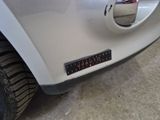 a close up of a car ' s bumper with a sticker on it