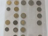 a lot of coins in a plastic bag on a table