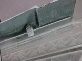 a close up of a piece of metal on a shelf