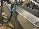 a conveyor belt in the middle of a factory