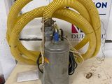 a yellow hose that is connected to a metal pump