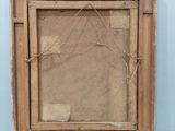 an old picture frame with a piece of paper taped to it