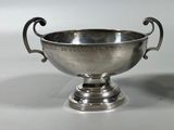 a silver plated bowl with handles and handles on a pedestal