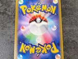 a close up of a pokemon card on a table