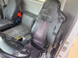 two seats in the back of a van with a bag on it