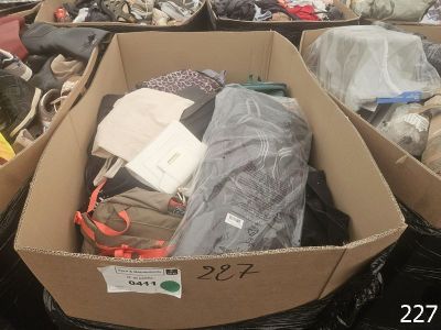two boxes full of clothes sitting on the ground