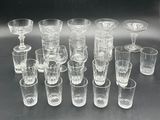 a lot of glasses that are sitting on a table