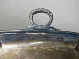 a silver plate with a ring on top of it