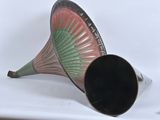 a black and red trumpet sitting on a white table
