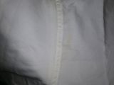 a close up of a white shirt with a black background