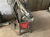 a machine that is sitting on the floor in the garage