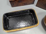 three wooden boxes and a bowl on a table