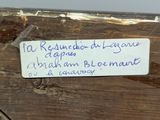 a label on a piece of wood that says