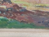 une image d'un tableau sur le mur d'une pièce