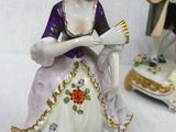 three figurines that are sitting on a table