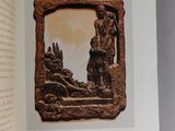 an open book with a picture of a man and a dog