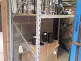 a shelf with pots and pans on it in a garage