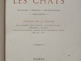 the front cover of a book with the title les chats written in red