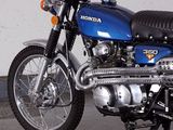 a blue motorcycle that is parked in a garage