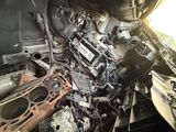 a pile of old engine parts in the back of a truck