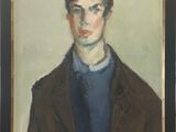portrait of a young man in a brown jacket and blue shirt