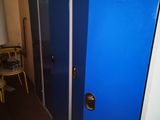 two blue lockers next to each other in a room