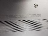 an image of a close up of a metal object with holes on it