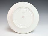 a white plate that has a white design on it