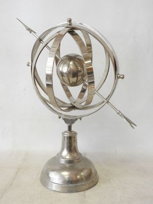 an image of a metal object on a stand on a white surface