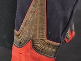 a close up of a pair of gloves on a mannequin head