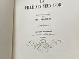 a book open to a page with a picture of a bird on top of it