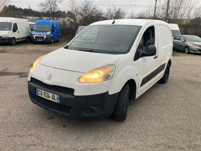 the white van is parked in a parking lot with other cars
