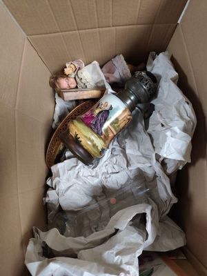 a cardboard box with a lot of stuff inside of it