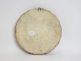 a small piece of wood with a tag on it