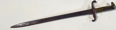 a small sword that is on a white surface