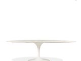 a white table with an oval marble top on a white background