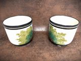 two cups that are sitting on a table