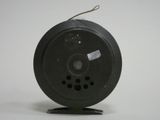 a black object on a stand with a white background