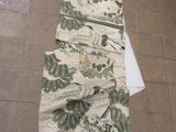 an image of a long table runner with a floral design on it