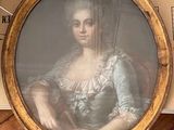 a picture of a woman sitting in a chair in a room