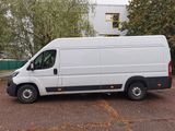 a white van that is parked in a parking lot