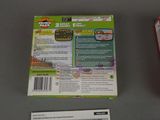 a video game on the table next to the box