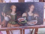un tableau représentant deux femmes tenant des assiettes remplies de nourriture, posé sur un chevalet