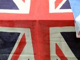 a table with a flag on it and a plate of food in front of it
