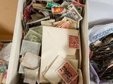 a box full of different types of stamps on a table