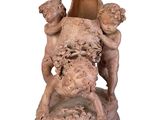 a statue of a man and a woman on a pedestal