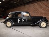 a black car that is parked in a garage